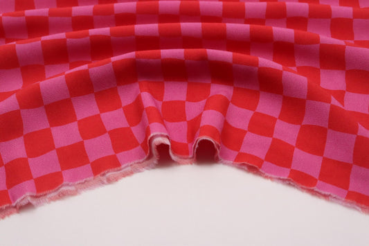 Tissu crêpe de viscose à damiers roses et orange graphique