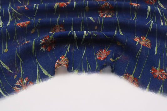 Tissu voile de crêpe viscose fond bleu imprimé fleurs