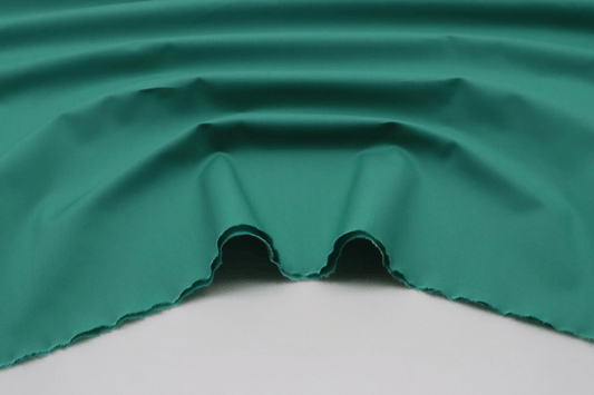 Tissu popeline de coton vert amande