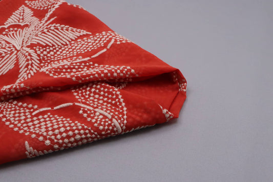 Tissu polyester brodé terracota fleurs hawaiennes
