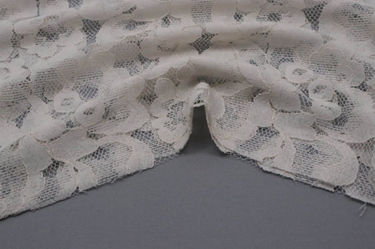 Tissu dentelle motif fleuri blanc 