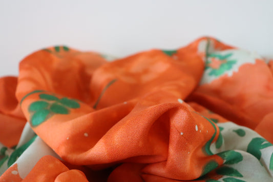 tissu crêpe de viscose orange  à fleurs